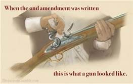A man holding an old gun with the words " one and amendment was written this is what a gun looks like ".