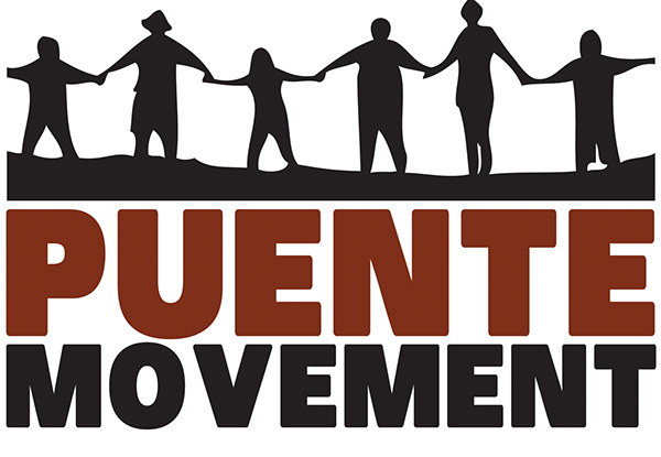 A group of people holding hands in front of the words " puente movement ".