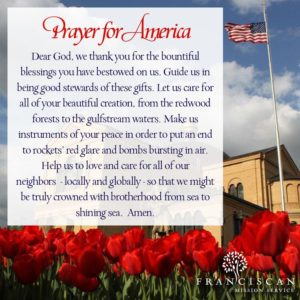 A prayer for america with flowers and the american flag.
