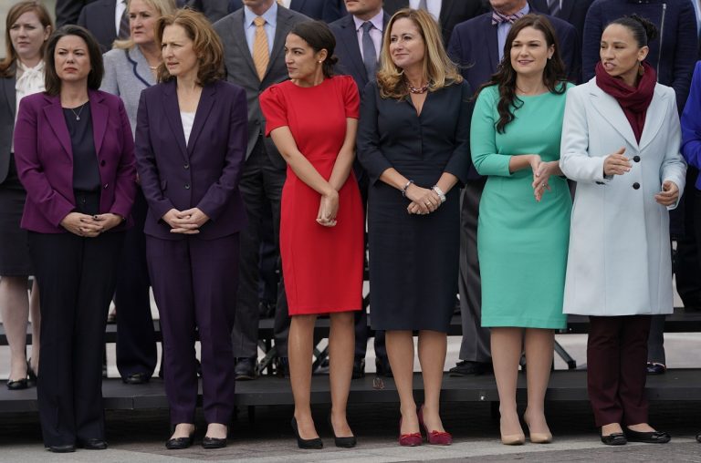 A group of women standing next to each other.